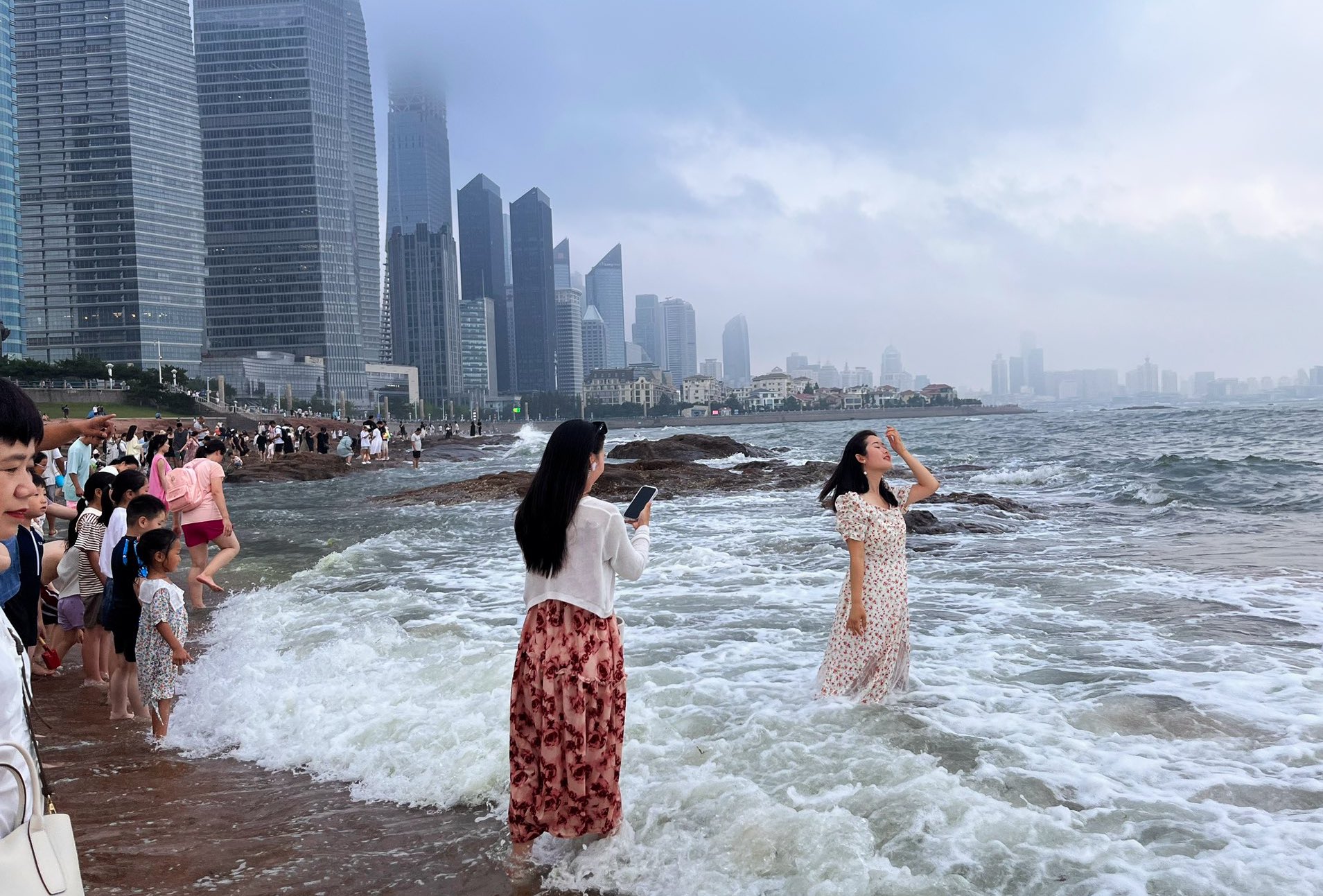 Along a brand new business district, the
Number One bathing beach is located at Huiquan Bay, Qingdao, Shandong Province, in Eastern China. The local residents started to enjoy this beach after the German colonial government left China